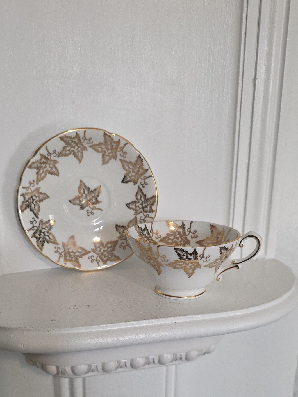 vintage Stanley Bone China teacup and saucer set featuring a gold maple leaf